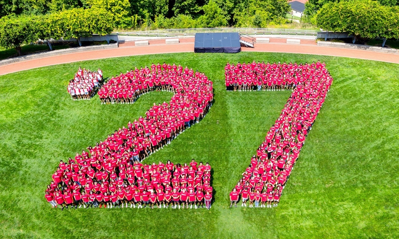 Students lined up to spell out the number 27