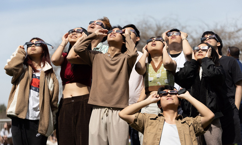 Students watching the solar eclipse