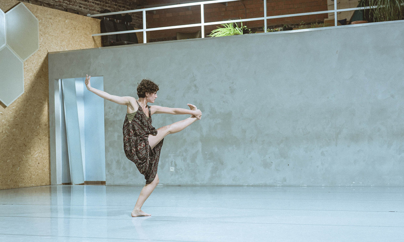 Photo of a dancer performing a solo dance.