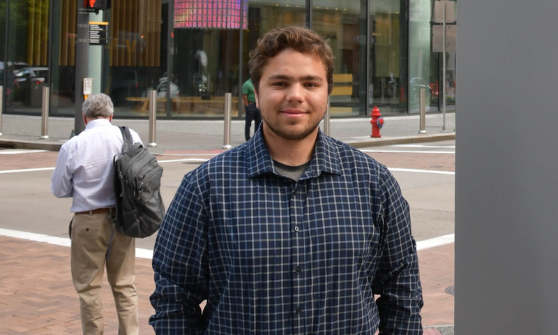 Cole Shegan Siniawski ’26 standing outside the PNC building in downtown Pittsburgh.