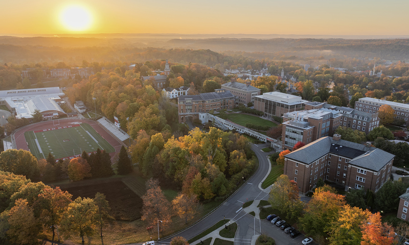 A drone image shows portions of campus during sunrise.
