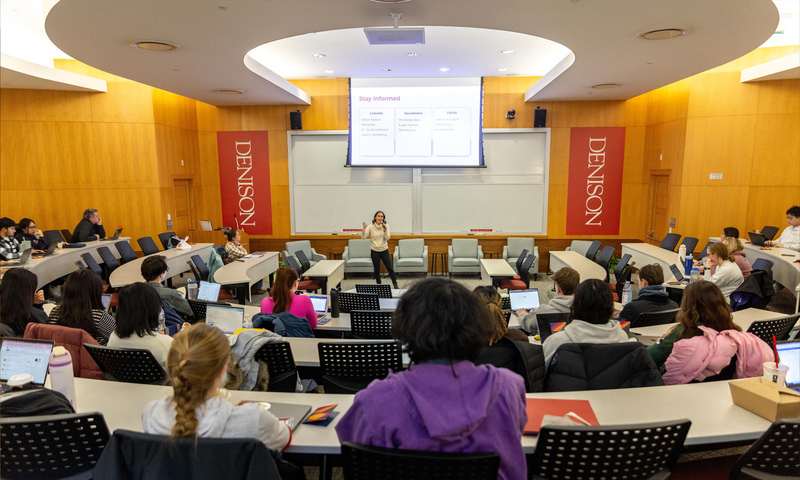 Photo of Denison students seated in a lecture hall learning about the uses of AI during a Spring 2025 workshop.