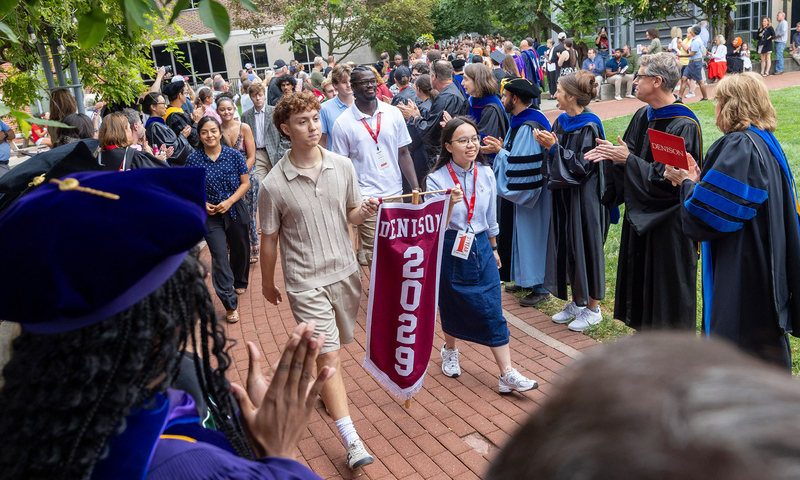 Members of Denison's faculty applaud a procession of the Class of 2029 prior to the start of Denison's Induction ceremony.