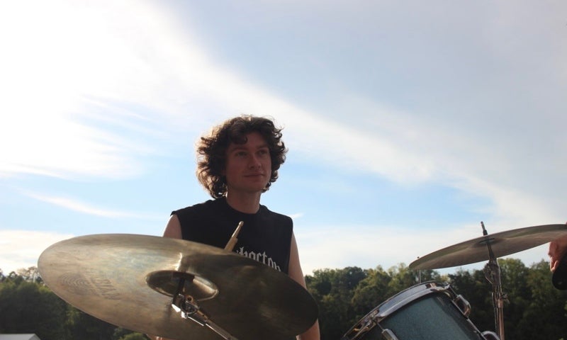Mick Smith plays the drums.