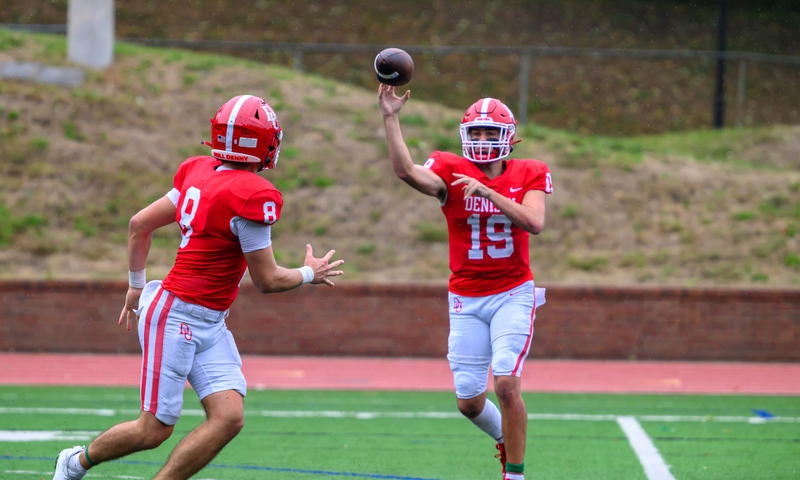 Two football players on a football field.
