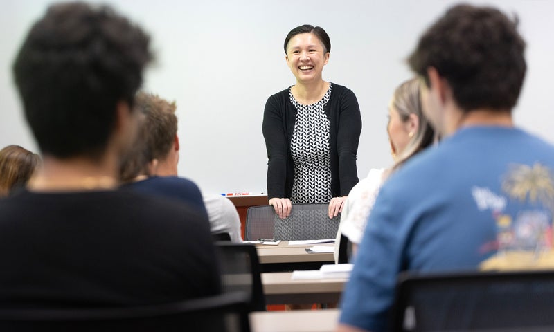 Photo of a May Mei teaching a class.
