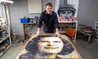 Christian Faur displays a photo-realistic portrait of American mathematician Julia Robinson that is made from crayons