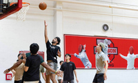 Denison students playing basketball.