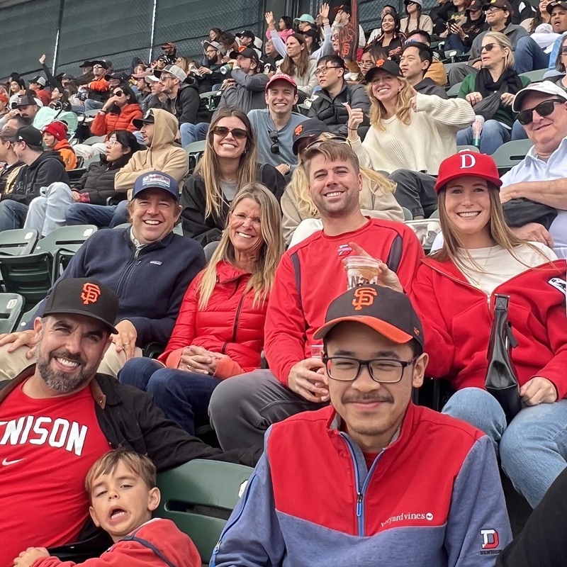 Denison alumni in the stands at an MLB baseball game.