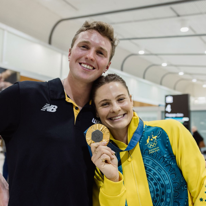 James Baker greeted Olympic pole vault champion Nina Kennedy at the airport in Perth, Australia after she returned from Paris. 