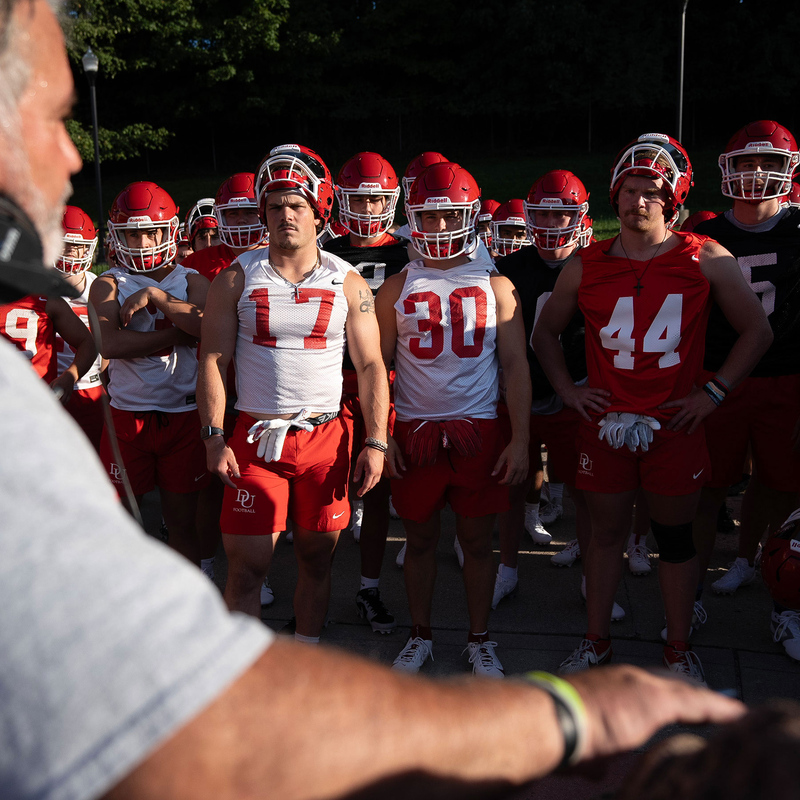 Head Coach talking to football team