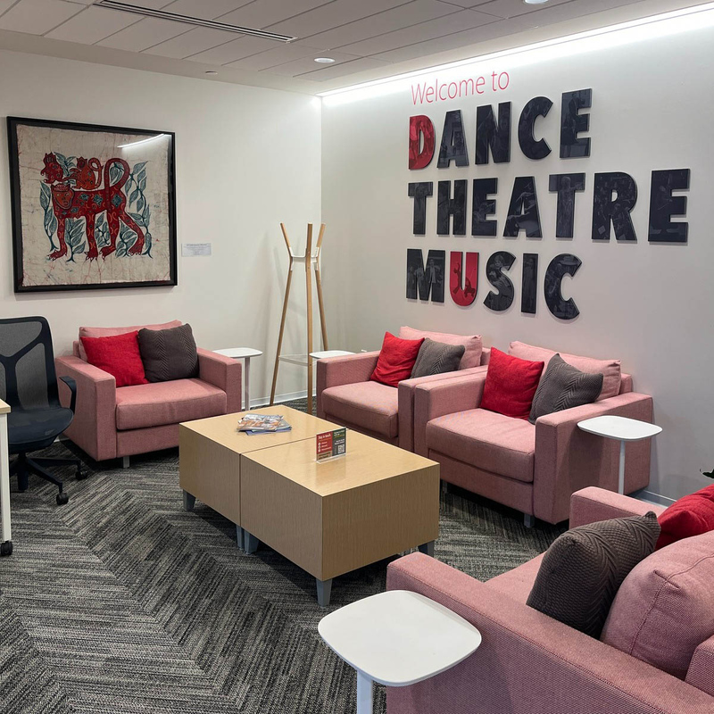 Dance Theatre Music sign above seating area.