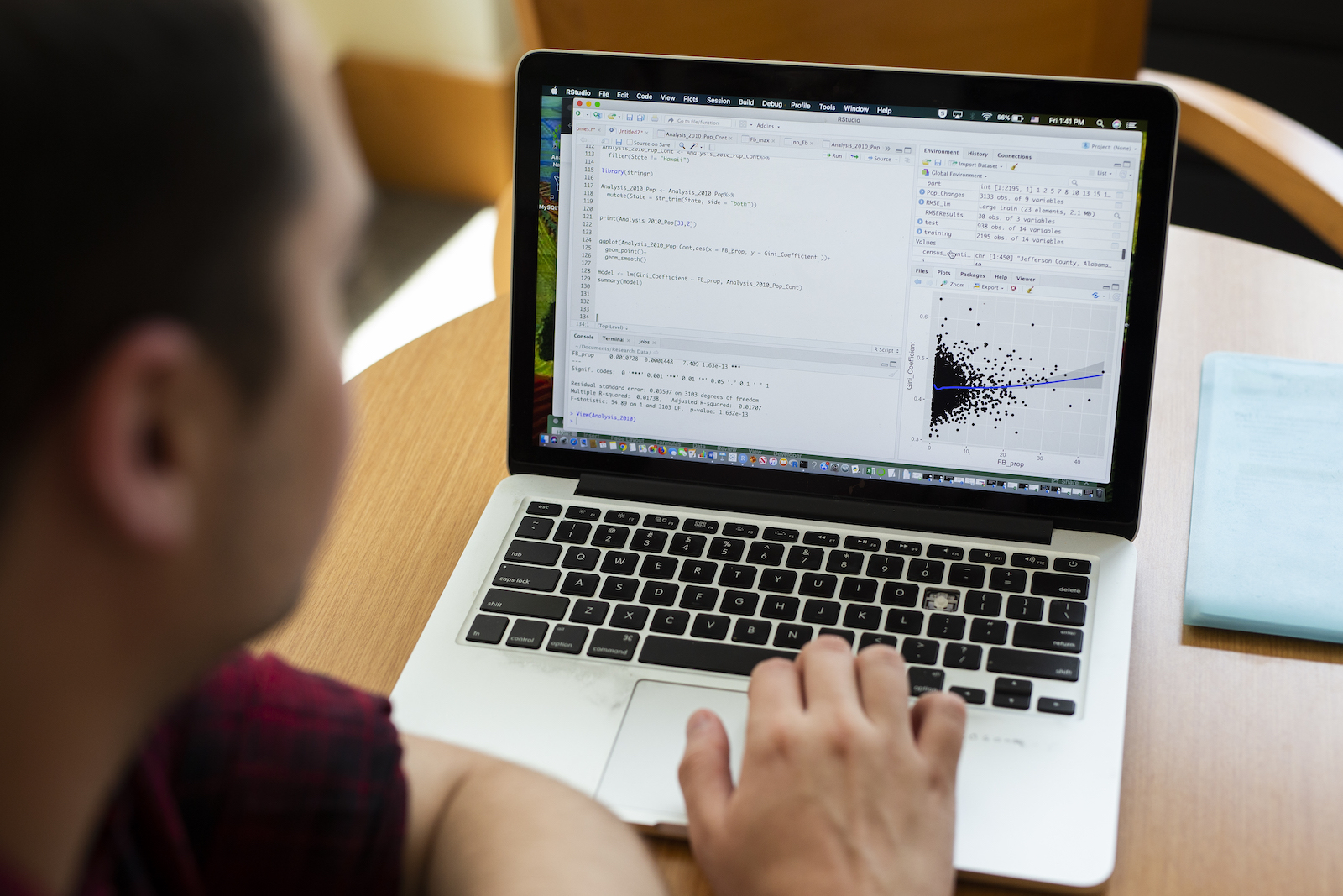 Data Analytics student working on computer