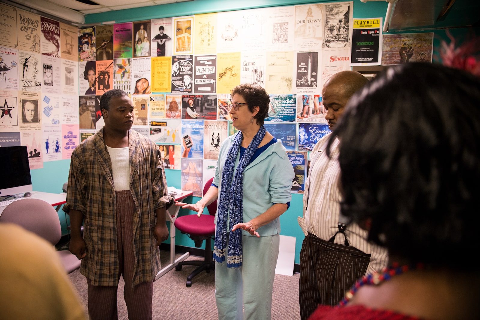 Faculty member talking to students in class