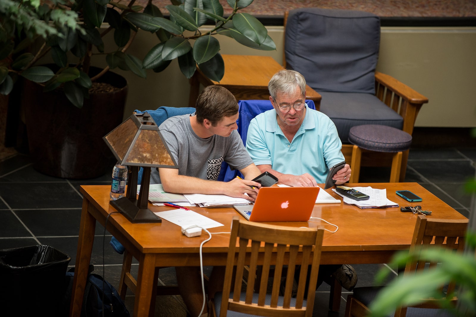 Faculty working with student at table