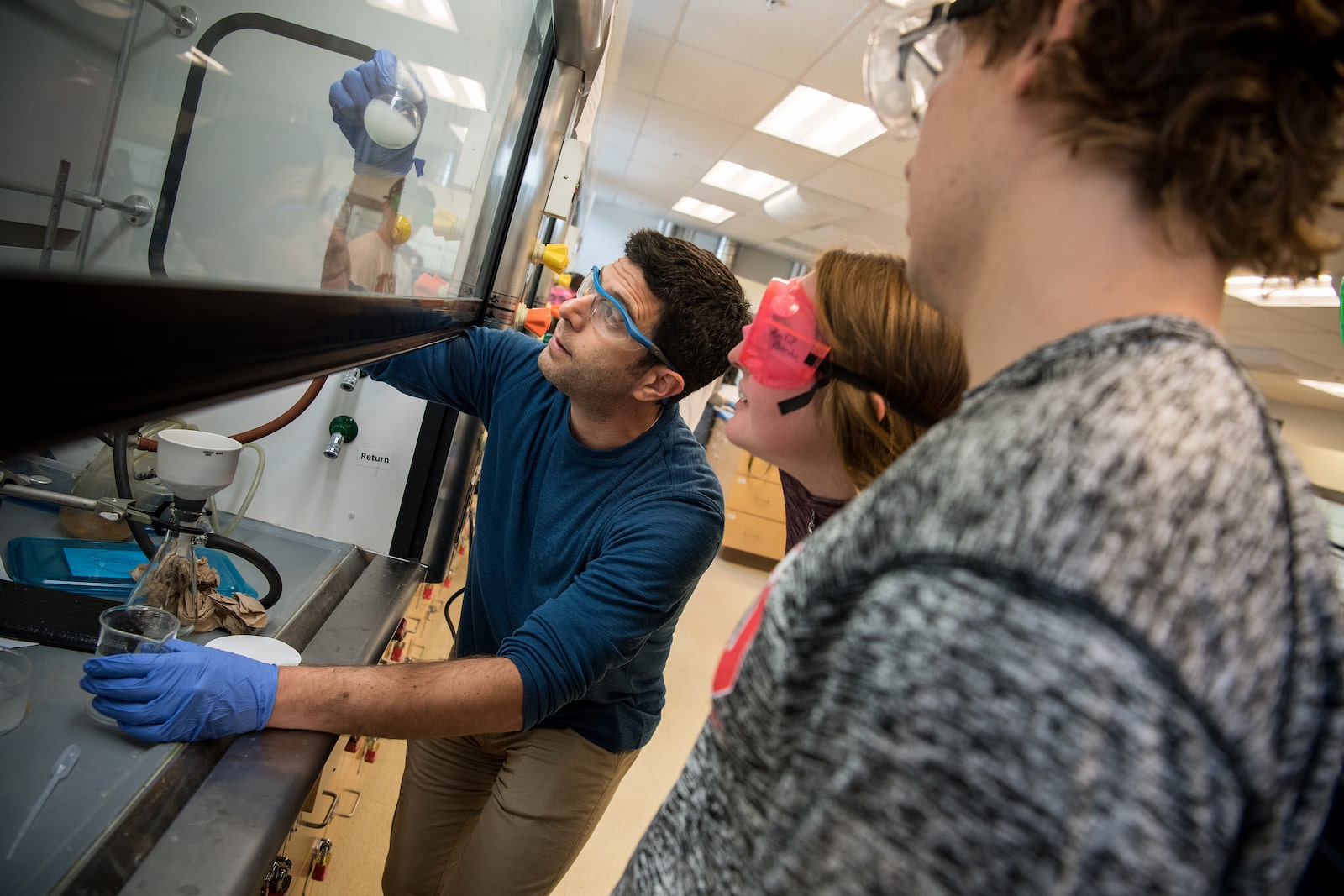 Chemistry professor working with students