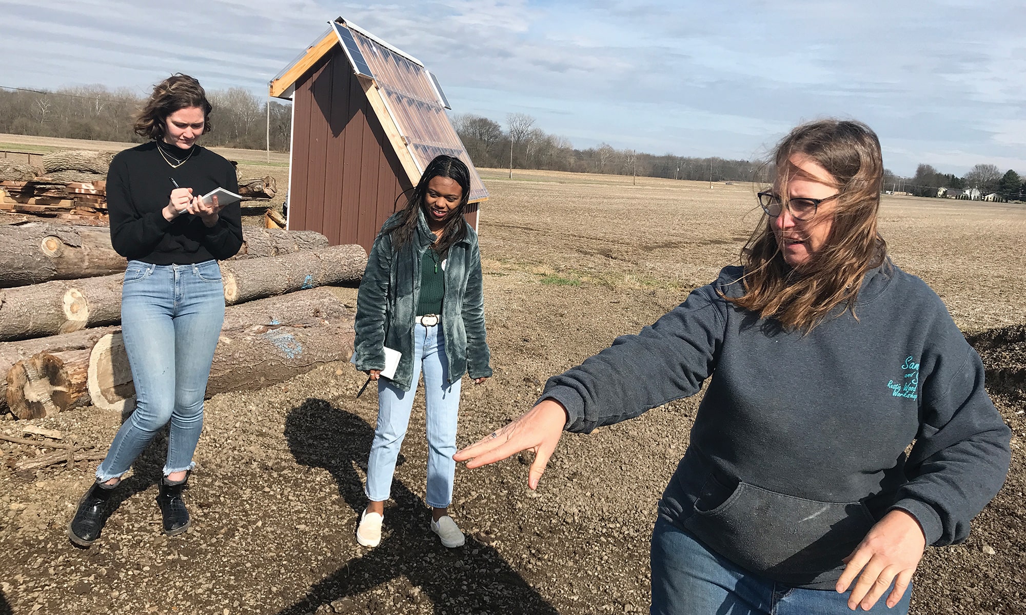 ON ASSIGNMENT: Boirard and Jen Clancey ’23 tour Sand and Sip Rustic Wood Workshop in Johnstown, Ohio, with one of its owners, Amy Kent.