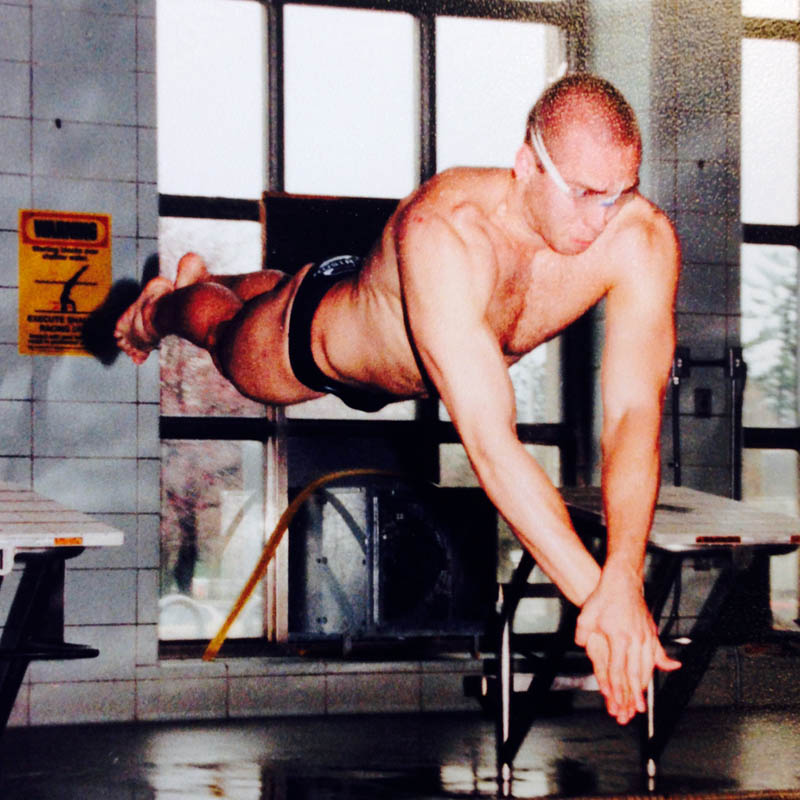 Aaron Cole competing as a swimmer during his years at Denison.