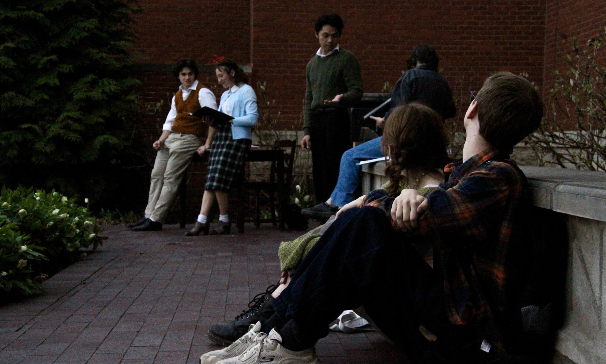 Students gathered to watch and perform a play.