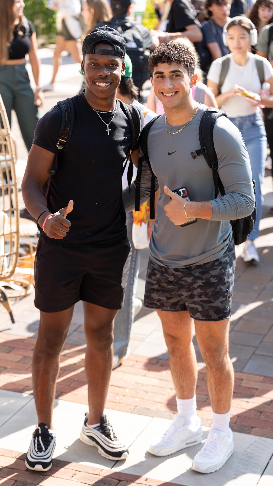 Two students smiling on the first day of class.