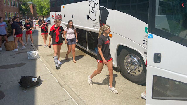 Students walk toward the bus.
