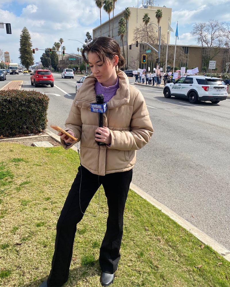Lena Folke ’22 reporting live at a news event in southern California.
