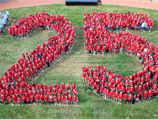 The Class of 2025 poses in a group photo in the shape of the number '25' on Reese~Shackelford Common.
