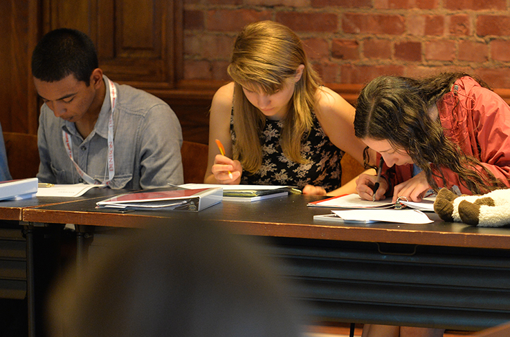 Students working at the Reynolds Young Writer's Workshop